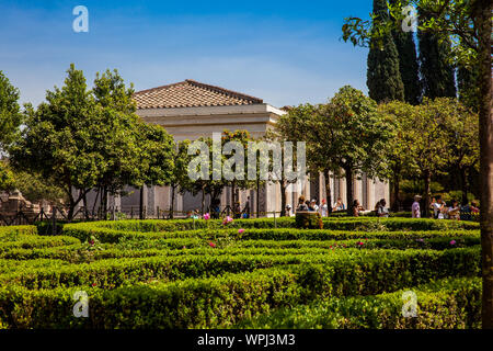 ROME, ITALY - APRIL, 2018: Tourists visiting the Renaissance Farnese Aviaries and Gardens at the Palatine Hill in Rome Stock Photo