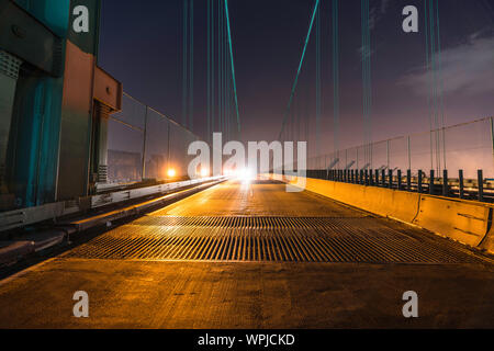 Night view of Vincent Thomas Bridge road grates and on coming headlights in Los Angeles, California. Stock Photo