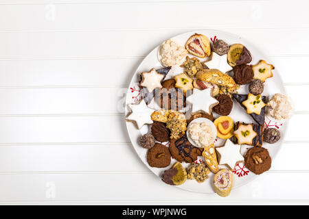 Assorted homemade Christmas cookies on wooden table Stock Photo
