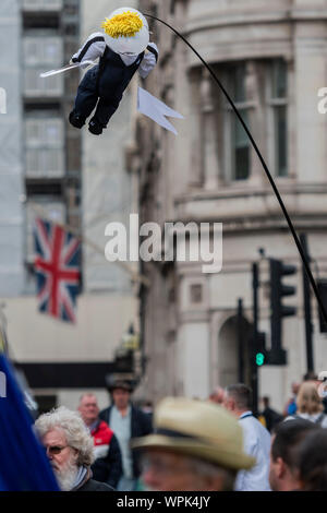 London, UK. 09th Sep, 2019. A puppet Boris flies over the gates - People await the arrival of Prime Minister Boris Johnson on the last day before he ends this session of Parliament early. Credit: Guy Bell/Alamy Live News Stock Photo