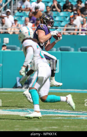 Baltimore Ravens tight end Hayden Hurst (81) runs with the ball