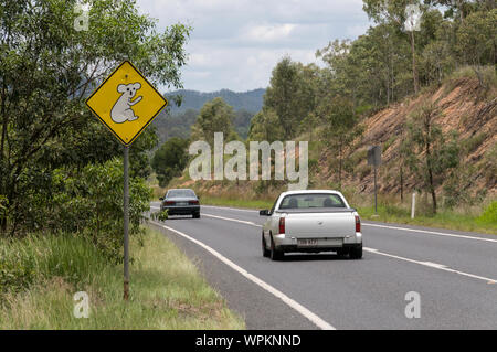 A Koala warning sign seen on roads that have local koala habitat in Queensland, Australia.   The sign warns motorists that they are approaching a loca Stock Photo