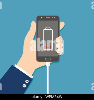 Hand holding smartphone with charger connected and low battery icon on screen. Flat vector illustration Stock Vector