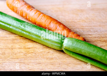 Raw celery and carrot on a cutting board Stock Photo