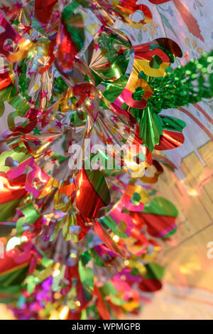 Colorful Sukkah decoration shiny garland at sunset light. Stock Photo