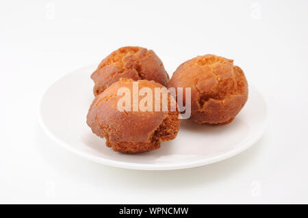 Sata Andagi okinawa dough nuts on plate isolated on white background Stock Photo