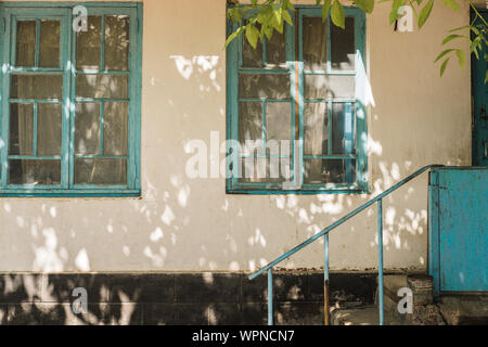 Blue wooden window of an old country house Stock Photo
