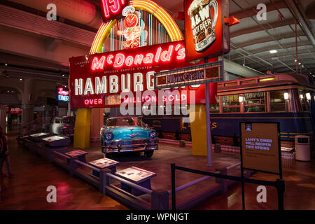 Dearborn, Mi, Usa - March 2019: The original Mcdonalds shop sign with one golden arch and 1956 Chevrolet Bel Air presented in the Henry Ford Museum of Stock Photo