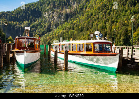 Electric tourist boats on beautiful lake Konigssee pier Berchtesgaden National Park Bavaria Germany Stock Photo