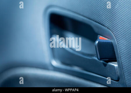 Car door plastic handle locked while driving. Close-up view Stock Photo