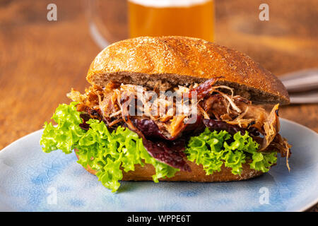 pulled pork in a bun with beer Stock Photo