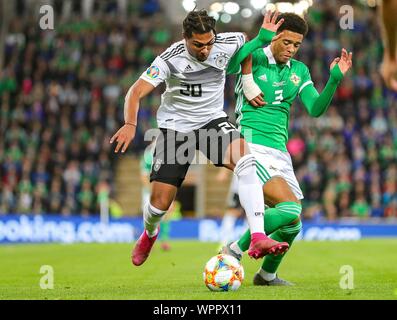 Belfast, UK. 09th Sep, 2019. Belfast, Grossbritannien. 09th Sep, 2019. firo: 09.09.2019 Football: Soccer EURO, Euro Qualification: Northern Ireland - Germany duels, Germany forward Serge Gnabry (20) tussles with Northern Ireland defender Jamal Lewis (3) | usage worldwide Credit: dpa/Alamy Live News Stock Photo