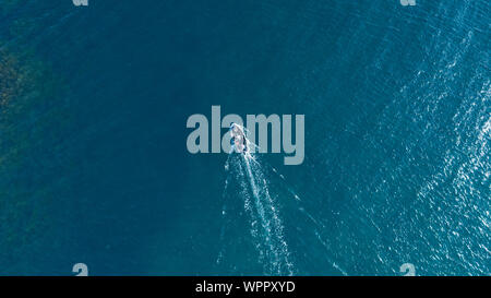 Sea surface with boat aerial view Stock Photo
