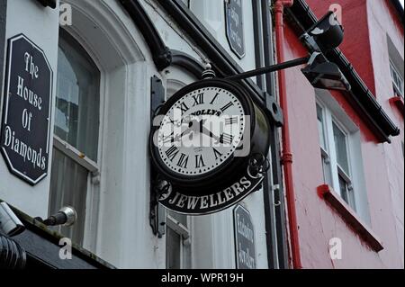 A large traditional shopfront clock outside a jewellers in Tralee, Co Kerry, Ireland Stock Photo
