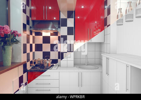 Modern interior of small red kitchen half finished, half 3d illustration clay render Stock Photo