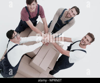 Young movers holding boxes. Delivering and transportation concept. Stock Photo