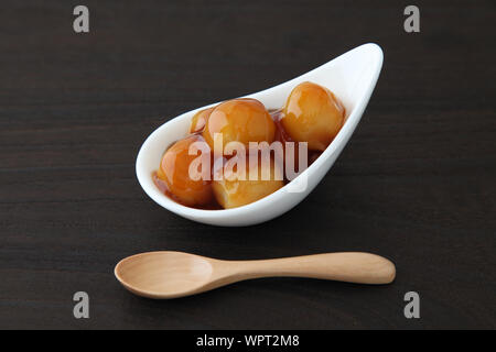 dango dumpling Japanese sweet dessert with rice on plate isolated on table mitarashi Stock Photo