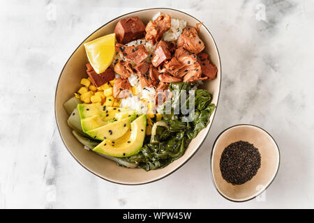 Vegan healthy bowl with rice, salad and jackfruit on light backround Stock Photo