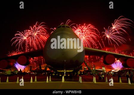 Spectacular fireworks explode behind massive Lockheed C-5M Super Galaxy ...