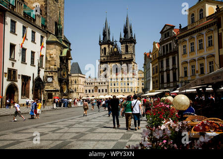 Looking towards Prague's Old Town Square with the Astronomical clock on the left and the twin Gothic steeples of Tyn Church directly ahead. Stock Photo