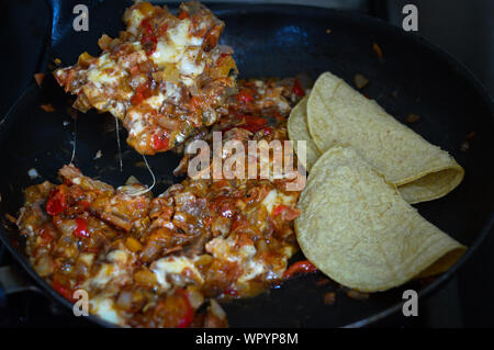 Authentic Mexican food,  tacos de alambre (steak, tomato, bacon, onion and cheese) Stock Photo