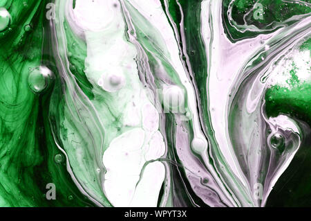 Green marble ink texture on watercolor paper background. Marble stone image. Stock Photo