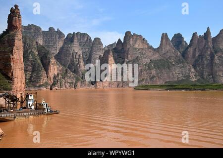 Liujiaxia Dam the picturesque place near the Bingling Cave with great rock formations along the Yellow River, Gansu province, China. Stock Photo