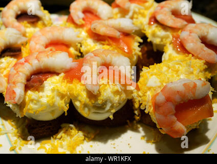 Pintxos served on the bar of a popular pintxo bar in San Sebastian, Basque country, Spain. Stock Photo