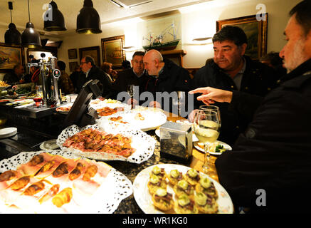 Pintxos served on the bar of a popular pintxo bar in San Sebastian, Basque country, Spain. Stock Photo