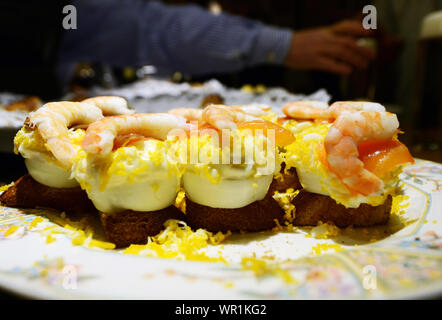 Pintxos served on the bar of a popular pintxo bar in San Sebastian, Basque country, Spain. Stock Photo