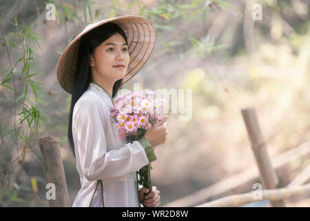 Beautiful woman with vienamt traditional dress,ao dai Stock Photo