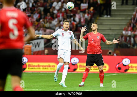 Warsaw, Poland. 09th Sep, 2019. Jan Bednarek from Poland (L) and Marko Arnautovic from Austria (R) are seen in action during the Euro 2020 Qualifiers (Group G) match between Poland and Austria.(Final score; Poland 0:0 Austria) Credit: SOPA Images Limited/Alamy Live News Stock Photo