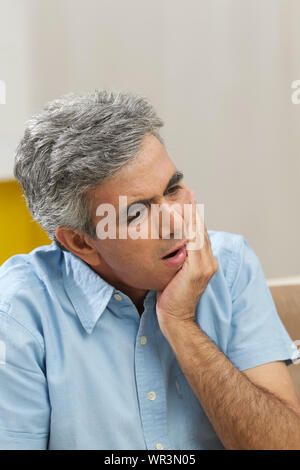 Senior man suffering from toothache Stock Photo