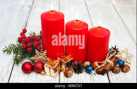 decorative christmas composition with red candles and pine Stock Photo