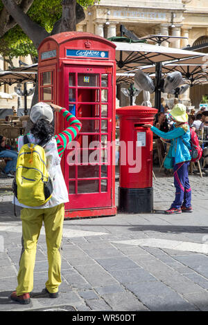 Typical mailbox, letterbox and telephone box, British style, in Valetta, Malta, Stock Photo