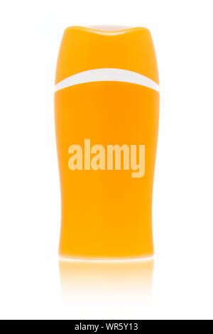 Blank orange sun cream bottle isolated on white background with fading reflection Stock Photo