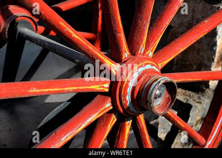 Red vintage wagon wheels. Stock Photo