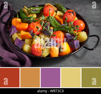 Color matching palette from rustic, oven baked vegetables in baking dish with purple potatoes