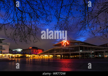 PARIS, FRANCE - FEBRUARY 16, 2014: night view of 'La Grande Halle'  in the Parc de la Villette, captured at the blue hour. Stock Photo