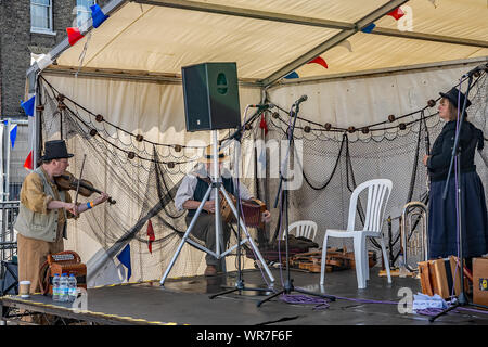 Great Yarmouth, Norfolk, UK – September 08 2019. A folk band getting ready and warming up before their performance at the Great Yarmouth Maritime Fest Stock Photo