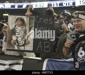 Oakland Raiders wide receiver Antonio Brown holds his jersey during an NFL  football news conference, Wednesday, March 13, 2019, in Alameda, Calif. (AP  Photo/Ben Margot)