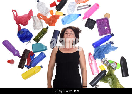 portrait of a woman sad lying  with plastics in white background Stock Photo