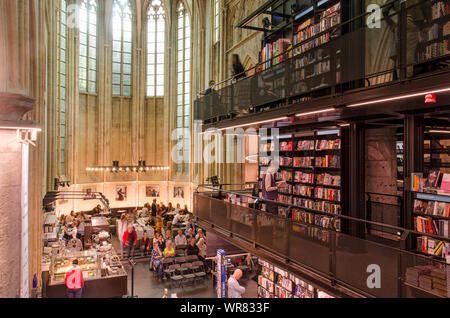 Maastricht, The Netherlands, September 8, 2019: interior view of the Dominican church, converted to a bookstore, with floors and bookshelves in the na Stock Photo