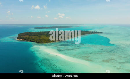 Island with a sandy beach and azure water surrounded by a coral reef and an atoll, aerial view. Mansalangan sandbar, Balabac, Palawan, Philippines. Summer and travel vacation concept Stock Photo