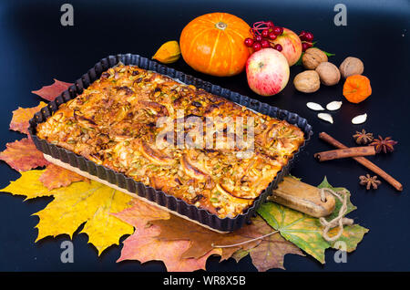 Homemade apple pie with nuts and pumpkin seeds.  Stock Photo