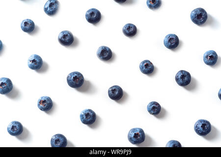 Flatlay pattern with fresh ripe blueberries isolated on white background Stock Photo
