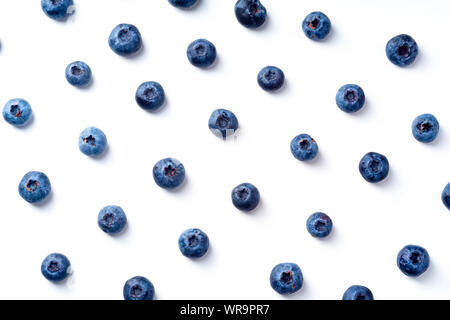 Flatlay pattern with fresh ripe blueberries isolated on white background Stock Photo