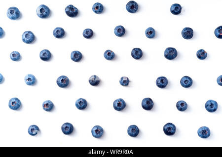 Flatlay pattern with fresh ripe blueberries isolated on white background Stock Photo
