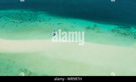 Sand bar in transparent turquoise water top view. Tropical beach with tourists. Mansalangan sandbar, Balabac, Palawan, Philippines. Summer and travel vacation concept Stock Photo