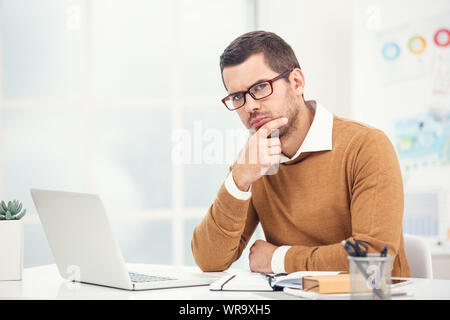 Young stylish business man in the ofiice Stock Photo